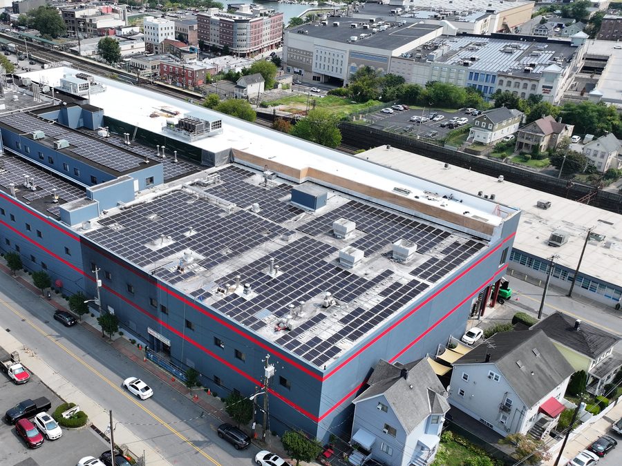 Wide aerial view of a commercial bakery with rooftop solar