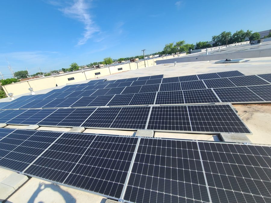 Rooftop solar panels under a clear sky in New Jersey