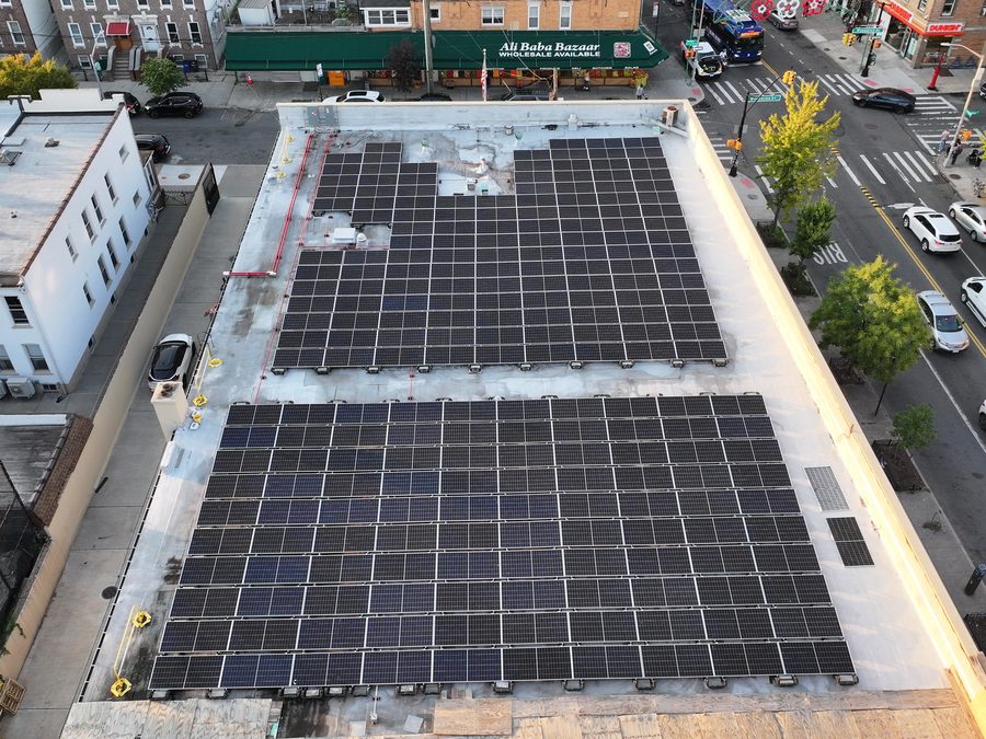 Top-down drone view of a retail store rooftop solar array
